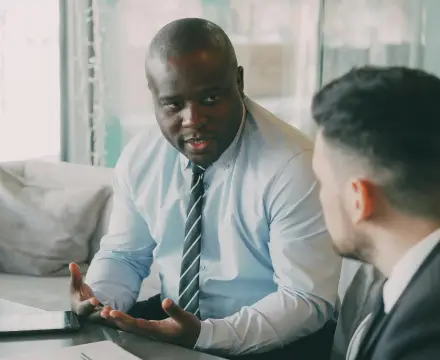 A man discussing with his colleague