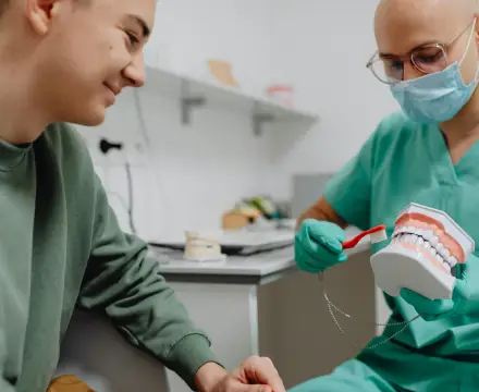 A doctor demonstrating dentures